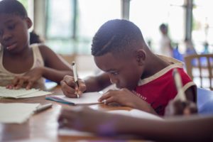 child working on school