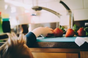 child eating healthy snacks