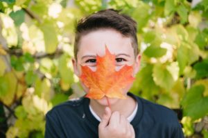 child enjoying fall flavors and scents